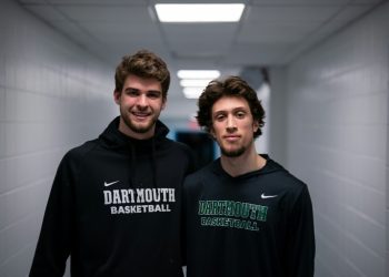 Cade Haskins, left, and Romeo Myrthil, right, were among those who led players on Dartmouth College's basketball team to vote to unionize as school employees. ©AFP