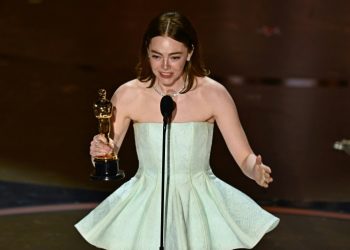 Emma Stone was emotional as she accepted the best actress Oscar for 'Poor Things' -- it is her second Academy Award. ©AFP