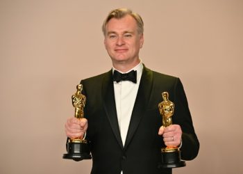 Christopher Nolan is finally an Oscar winner -- he posed with his awards for best director and best picture for 'Oppenheimer'. ©AFP