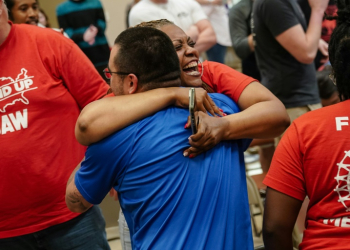 People celebrate after the United Auto Workers (UAW) received enough votes to form a union at a UAW vote watch party on April 19, 2024 in Chattanooga, Tennessee. ©AFP