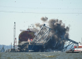 Crews conduct a controlled demolition of a section of the Francis Scott Key Bridge resting on the Dali container ship in Baltimore on May 13, 2024. ©AFP