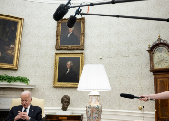 US President Joe Biden listens during a meeting with Romanian President Klaus Iohannis (out of frame) in the Oval Office -- but did not speak about Israel-Hamas ceasefire talks / ©AFP